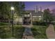 Charming exterior of a two-story townhouse with well-maintained landscaping and inviting entrance at dusk at 13762 E Lehigh Ave # G, Aurora, CO 80014