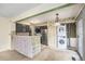 Open kitchen space with laundry appliances and a breakfast bar at 13762 E Lehigh Ave # G, Aurora, CO 80014