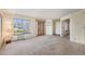 Bright and airy living room with large windows, new carpet and natural light at 13762 E Lehigh Ave # G, Aurora, CO 80014