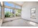 Light-filled living room with large windows offering neighborhood views at 13762 E Lehigh Ave # G, Aurora, CO 80014
