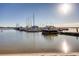 Boats sit calmly in this marina scene, reflecting the morning sun off of the gentle water at 13762 E Lehigh Ave # G, Aurora, CO 80014