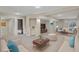 Finished basement boasts a neutral color palette, updated lighting, and comfortable seating at 21684 Swale Ave, Parker, CO 80138