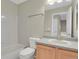 Clean bathroom featuring a single vanity, tiled bathtub, and modern fixtures at 21684 Swale Ave, Parker, CO 80138