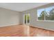 A bedroom with hardwood floors, sliding glass doors, and a view to the backyard at 21684 Swale Ave, Parker, CO 80138