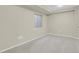 Basement bedroom has new carpet, neutral paint, and a window at 21684 Swale Ave, Parker, CO 80138