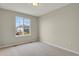 Neutral bedroom featuring carpet, one window, and base trim on the walls at 21684 Swale Ave, Parker, CO 80138