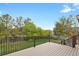 Spacious deck overlooks private backyard with mature trees at 21684 Swale Ave, Parker, CO 80138