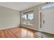 Inviting entryway with gleaming hardwood floors and plenty of natural light from large windows at 21684 Swale Ave, Parker, CO 80138