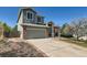 Lovely two-story home with a two car garage and a beautifully landscaped front yard at 21684 Swale Ave, Parker, CO 80138