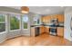 A kitchen with stainless steel appliances, wood cabinets, and hardwood floors at 21684 Swale Ave, Parker, CO 80138