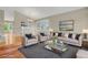 Bright living room with a comfortable seating area and a large window for natural light at 21684 Swale Ave, Parker, CO 80138