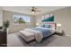 Serene bedroom featuring a large window and a ceiling fan at 21684 Swale Ave, Parker, CO 80138