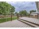 Beautiful backyard deck with wood flooring and steel cable railing at 845 S 9Th Ave, Brighton, CO 80601