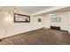 Spacious basement area with neutral paint and carpet throughout the room at 845 S 9Th Ave, Brighton, CO 80601