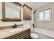 Bathroom features vanity with lots of storage and a shower over tub at 845 S 9Th Ave, Brighton, CO 80601