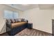 Cozy finished basement bedroom, complete with bed, pull-out drawers, and matching nightstand at 845 S 9Th Ave, Brighton, CO 80601