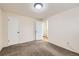 Bright bedroom with two doors, neutral paint, and carpet throughout at 845 S 9Th Ave, Brighton, CO 80601
