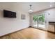 Bright dining area with hardwood floors and access to the outdoor deck at 845 S 9Th Ave, Brighton, CO 80601