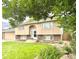 Charming home showcasing a well-manicured lawn, beautiful landscaping, and an inviting entrance at 845 S 9Th Ave, Brighton, CO 80601