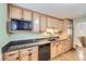 Kitchen with wooden cabinets, granite countertops and stainless steel appliances at 845 S 9Th Ave, Brighton, CO 80601