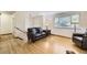Inviting seating area with hardwood floors and a cozy atmosphere at 845 S 9Th Ave, Brighton, CO 80601