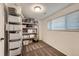 Finished basement storage room with steel shelving and window for natural light at 845 S 9Th Ave, Brighton, CO 80601