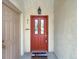 Inviting front door with glass paneling, house number and welcoming mat at 1703 Whitehall Dr # 5I, Longmont, CO 80504