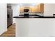 Kitchen featuring island and stainless steel refrigerator, and maple cabinets at 1703 Whitehall Dr # 5I, Longmont, CO 80504