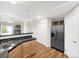 Well-equipped kitchen with stainless steel appliances, a breakfast bar, and ample cabinet space provides both style and functionality at 1703 Whitehall Dr # 5I, Longmont, CO 80504