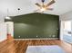 Bright living room featuring beautiful hardwood floors and a sliding door that leads to a private outdoor space at 1703 Whitehall Dr # 5I, Longmont, CO 80504