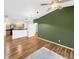 Open-concept living and dining area with a modern pendant light fixture is flooded with natural light at 1703 Whitehall Dr # 5I, Longmont, CO 80504