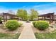 Beautiful community park featuring pergolas, lush greenery, stone pathways and landscaping at 1703 Whitehall Dr # 5I, Longmont, CO 80504