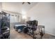 Cozy bedroom featuring a window, carpet, and a desk area at 12555 E Tennessee Cir # 302, Aurora, CO 80012