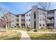 Attractive multi-story apartment building featuring balconies and well-maintained landscaping at 12555 E Tennessee Cir # 302, Aurora, CO 80012