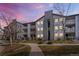 Attractive multi-story apartment building featuring balconies and well-maintained landscaping at 12555 E Tennessee Cir # 302, Aurora, CO 80012