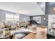 Living room with hardwood floors, comfy seating, and a grand piano at 19360 E 45Th Ave, Denver, CO 80249