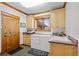 Functional laundry room with sink, washer, dryer, and plenty of cabinet space at 8912 Little Raven Trl, Niwot, CO 80503
