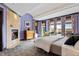 Serene main bedroom with stone fireplace, vaulted ceilings, and scenic views at 8912 Little Raven Trl, Niwot, CO 80503