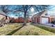 The property has a private backyard, detached garage, and mature trees at 1560 Hudson St, Denver, CO 80220