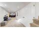 Finished basement hallway leading to recreational spaces and storage at 1560 Hudson St, Denver, CO 80220