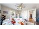 Bedroom with neutral walls, hardwood floors and a view into the hallway at 1560 Hudson St, Denver, CO 80220