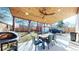 Covered patio features an outdoor dining area, a ceiling fan, and a barbecue grill at 1560 Hudson St, Denver, CO 80220