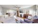 Cozy living room featuring a fireplace, hardwood floors, and a neutral sectional sofa at 1560 Hudson St, Denver, CO 80220