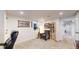 Basement office with a dark rolling chair, guitar, and shelving at 1560 Hudson St, Denver, CO 80220