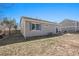 Exterior home view featuring a lawn with an outdoor patio at 19302 E 58Th Pl, Aurora, CO 80019