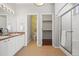 Spacious bathroom with double sinks, separate toilet room, and a glass shower at 19302 E 58Th Pl, Aurora, CO 80019
