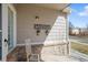 Charming front porch with a rocking chair, 'welcome' sign and decorative flower planters at 19302 E 58Th Pl, Aurora, CO 80019