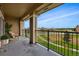 Cozy balcony with chairs offering views of a green neighborhood at 6212 Kilmer Loop # 202, Golden, CO 80403
