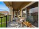 Balcony sitting area overlooking the neighborhood with table at 6212 Kilmer Loop # 202, Golden, CO 80403