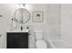 Modern bathroom featuring updated fixtures, stylish vanity, and tub with marble tile at 6212 Kilmer Loop # 202, Golden, CO 80403